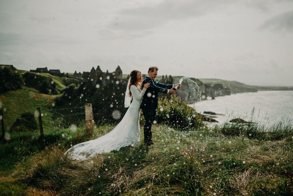 Couple celebrating their vow renewal in Ireland at Dunluce Castle