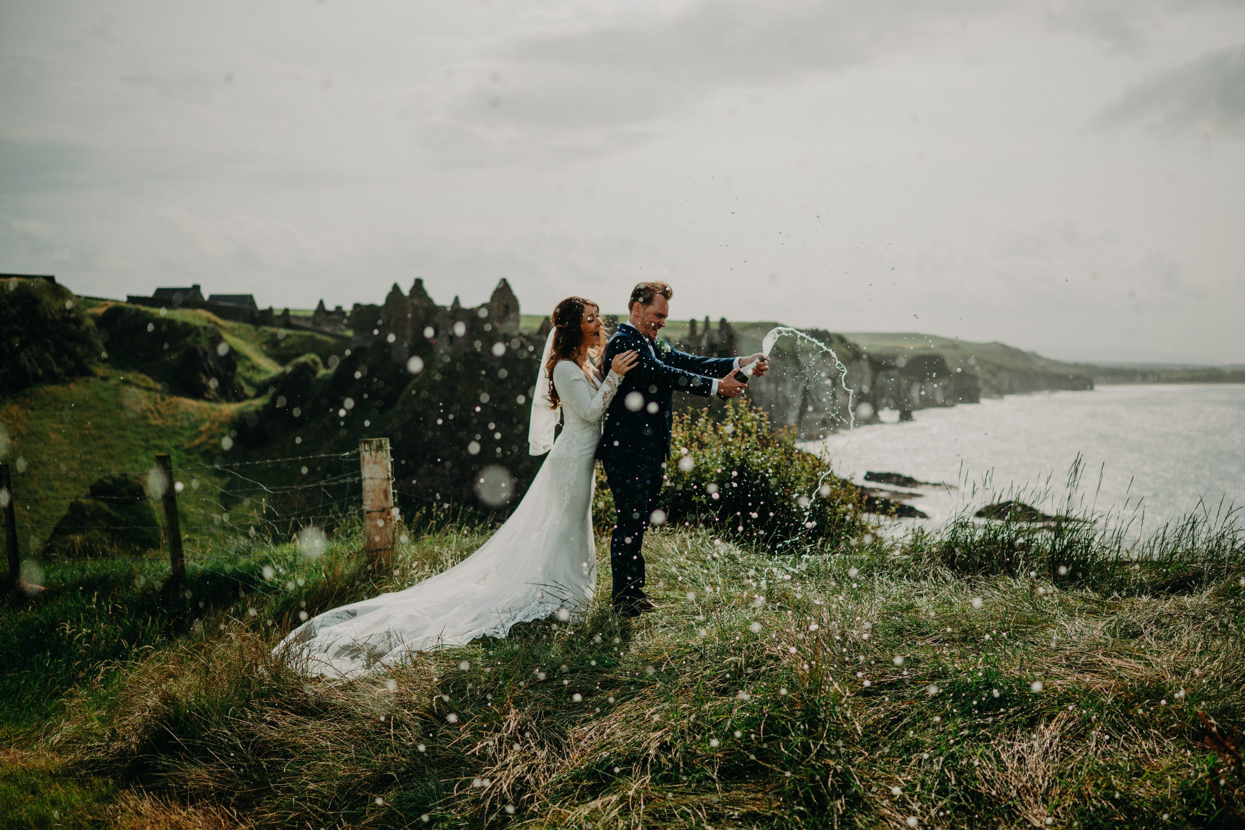 Couple eloping in Ireland at Dunluce Castle