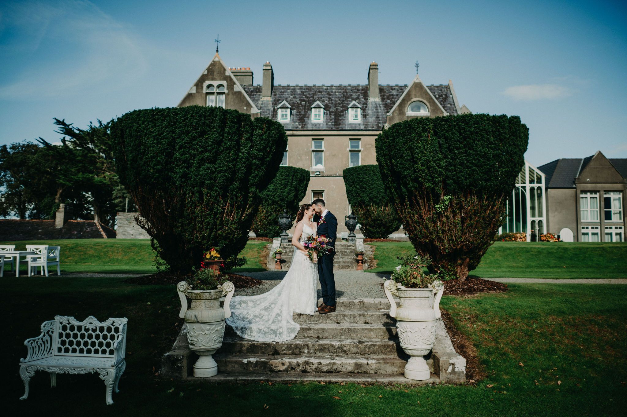 Couple embracing outside Cahernane House during Ireland elopement