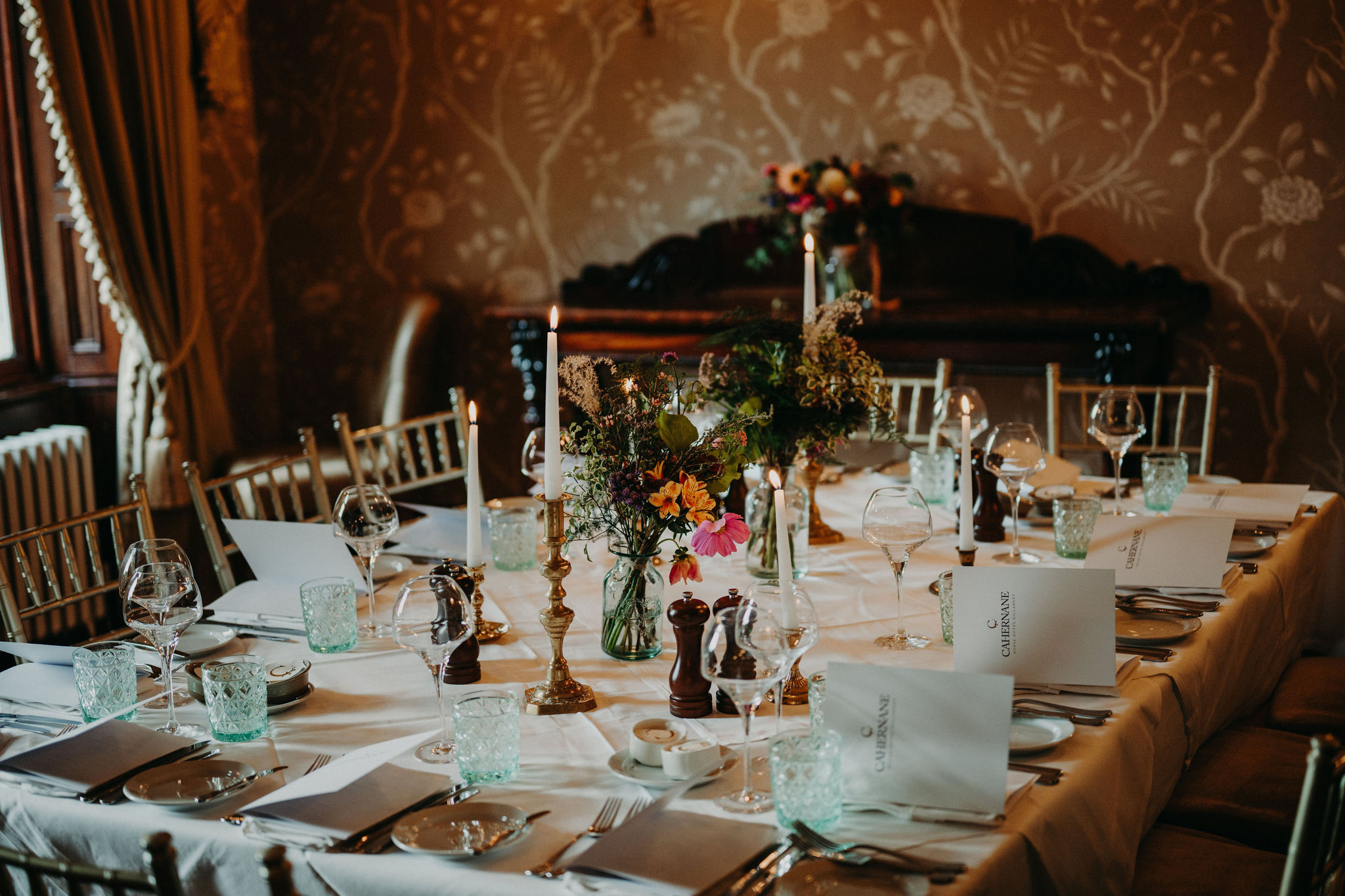 Elegant candlelit reception table setup for Ireland elopement celebration