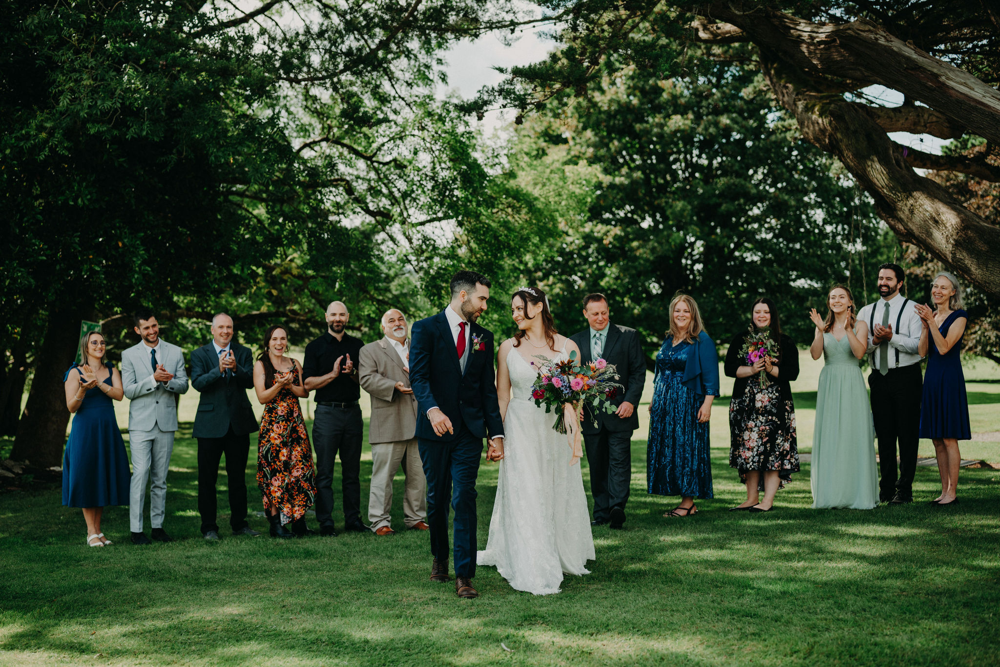Couple celebrating with guests after intimate Ireland wedding ceremony