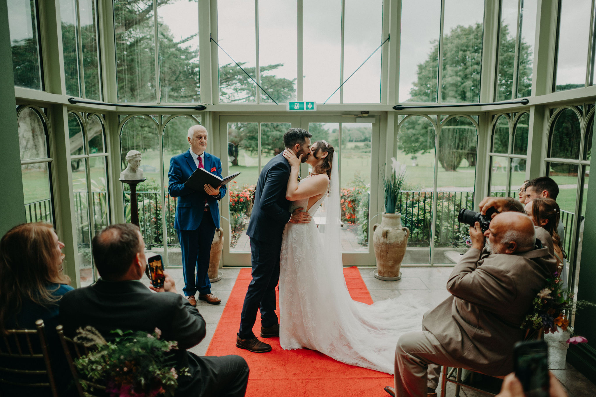 Indoor ceremony kiss during intimate wedding at Cahernane House