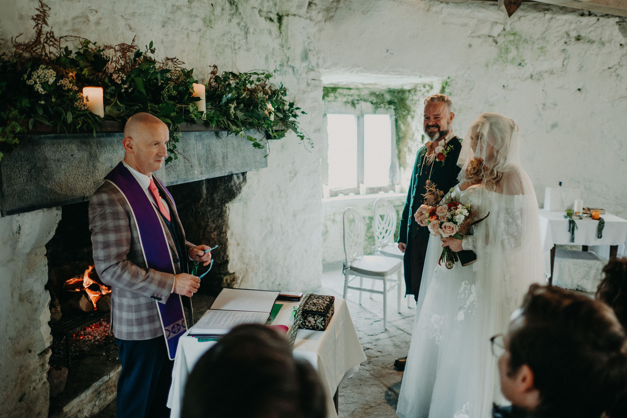 Bride and groom standing inside Newtown Castle during Ireland elopement ceremony.