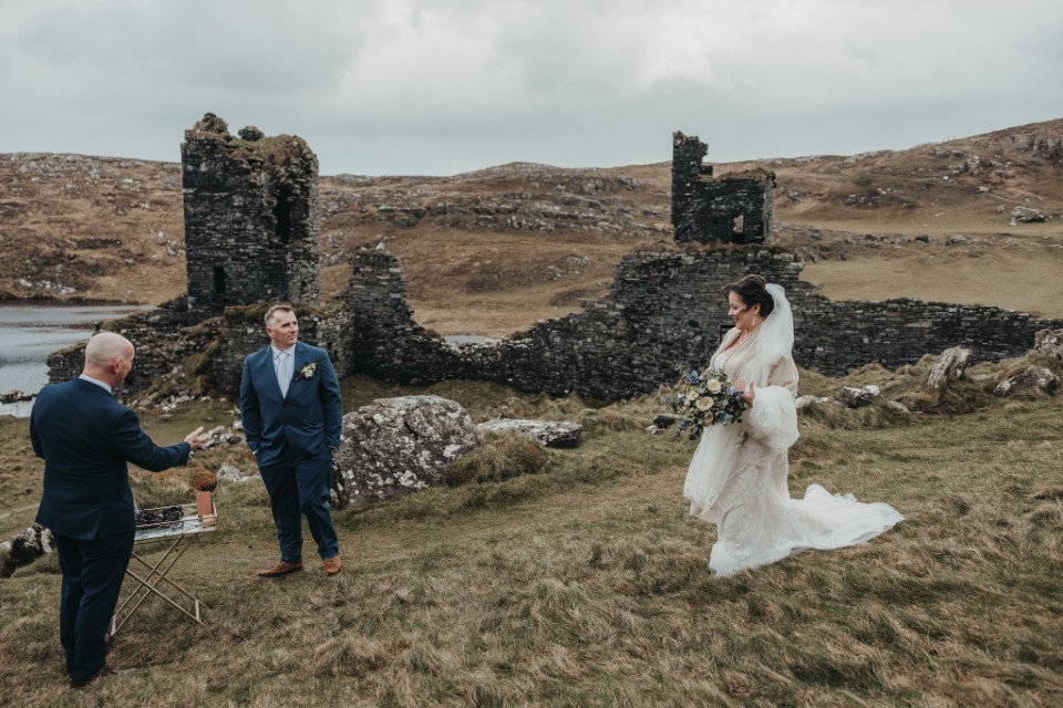 Bride arriving at an intimate Ireland elopement ceremony near historic ruins.